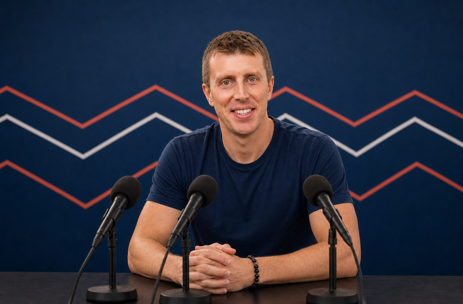 Zac Weikal at a press conference desk ready to answer questions